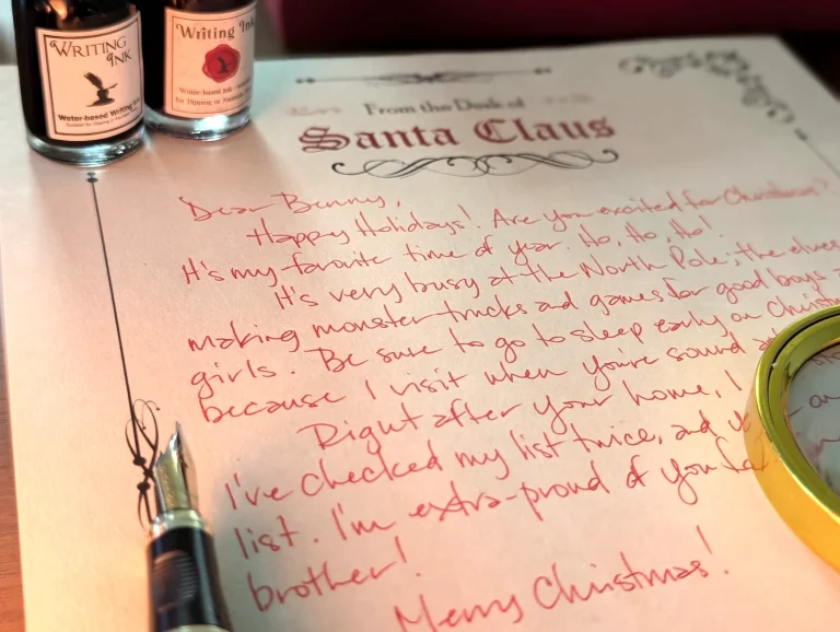 A full letter from Santa handwritten in red ink on Santa Claus letterhead