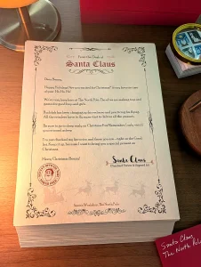 The free printed letter from Santa on the letter stack with its hand-addressed red envelope